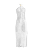 A white fringe dress against a white wall.