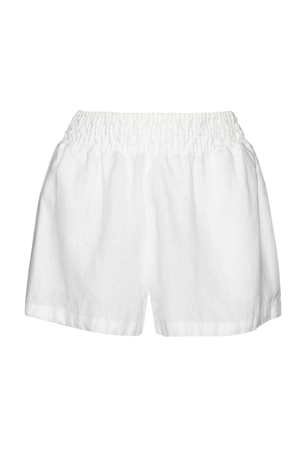 White linen shorts against a white wall.