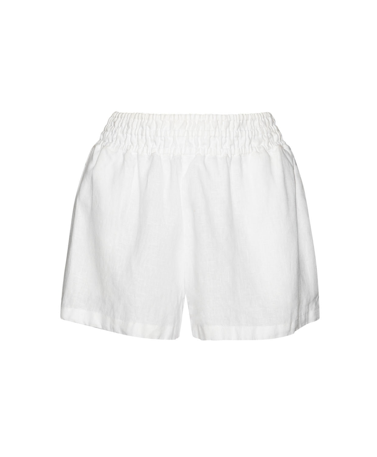 White linen shorts against a white wall.