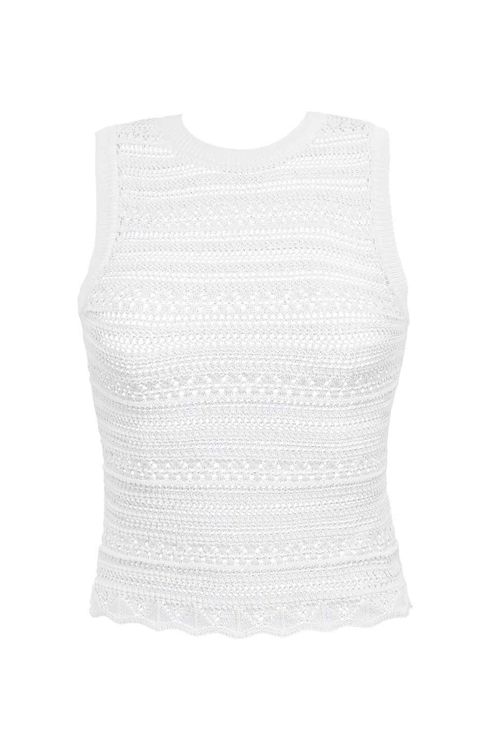 A white crochet top against a white wall.