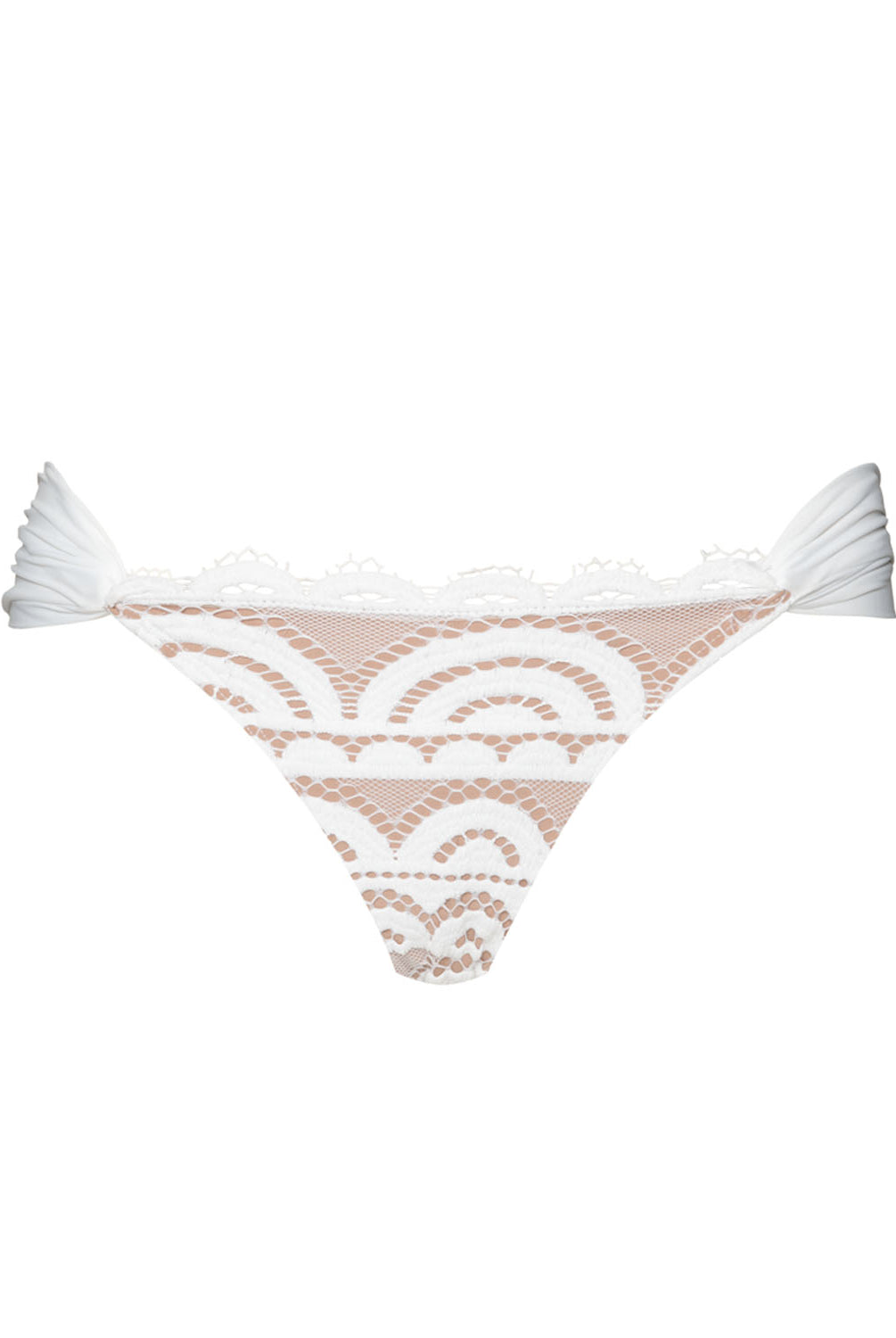 A white lace bikini bottom against a white wall.