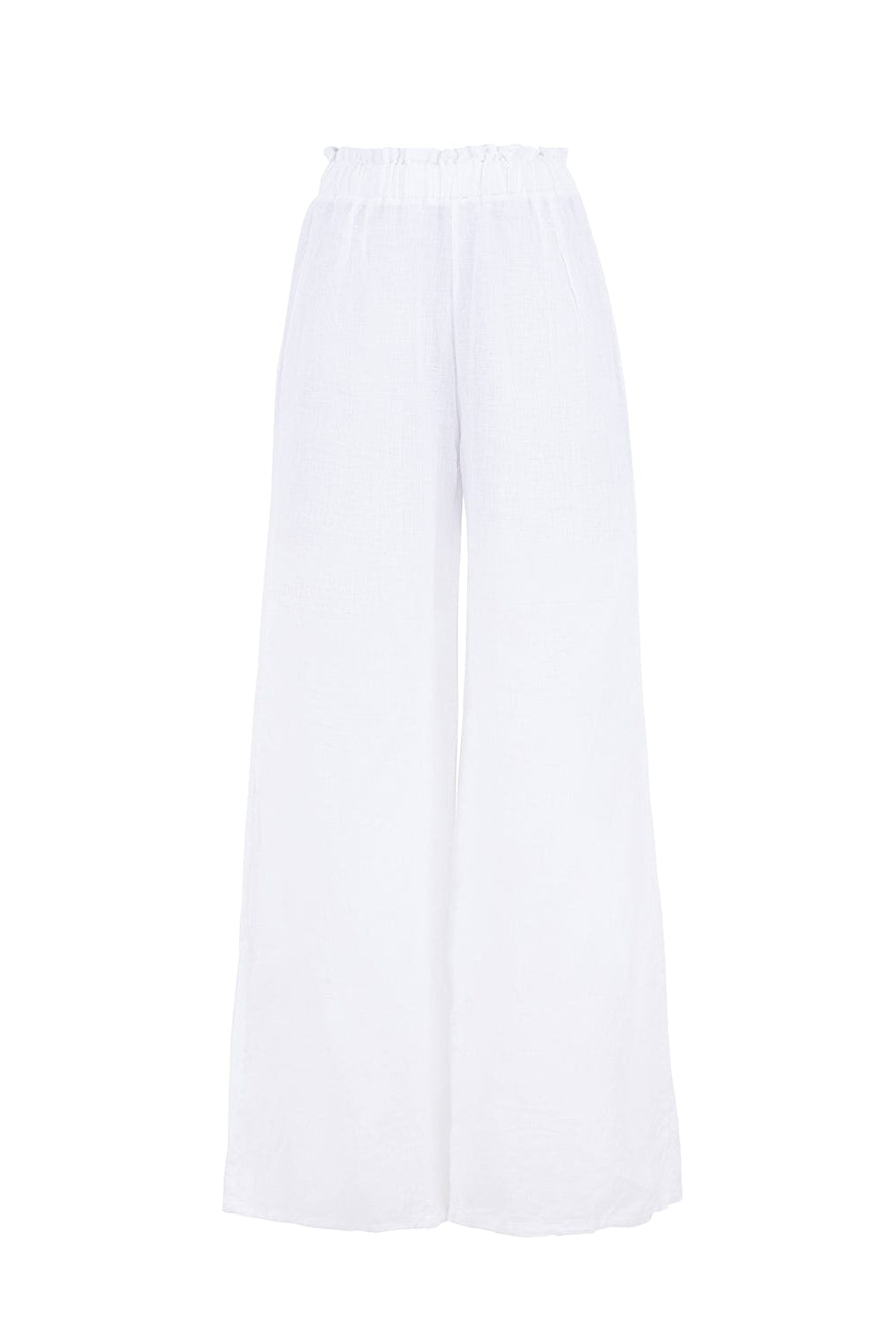 Long white linen pants against a white wall.