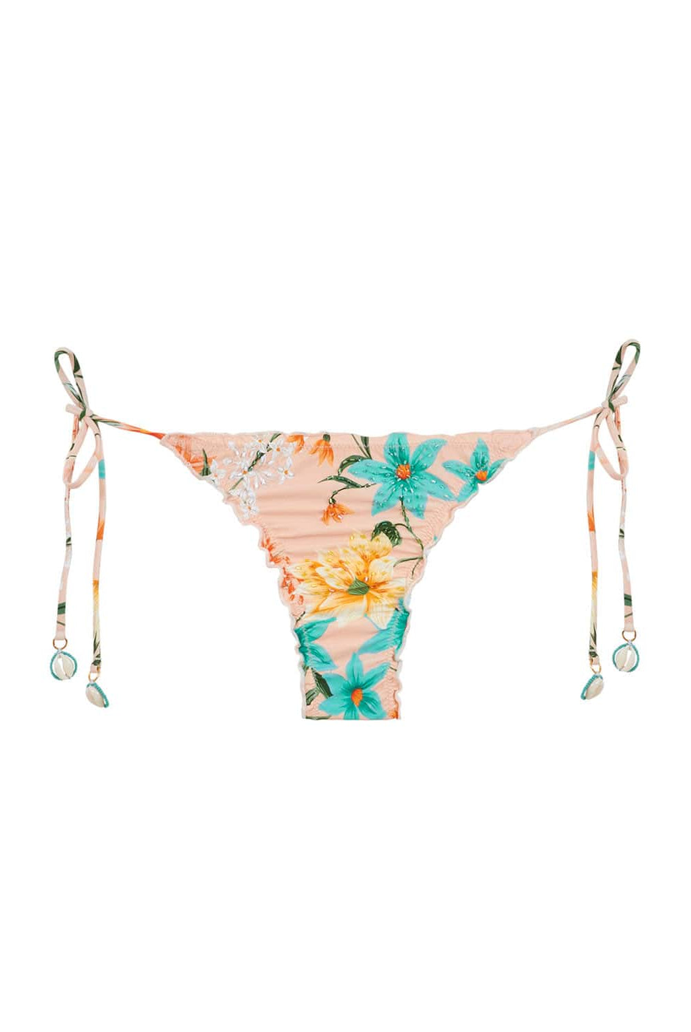 A bikini bottom with a tropical print and puca shells against a white wall.