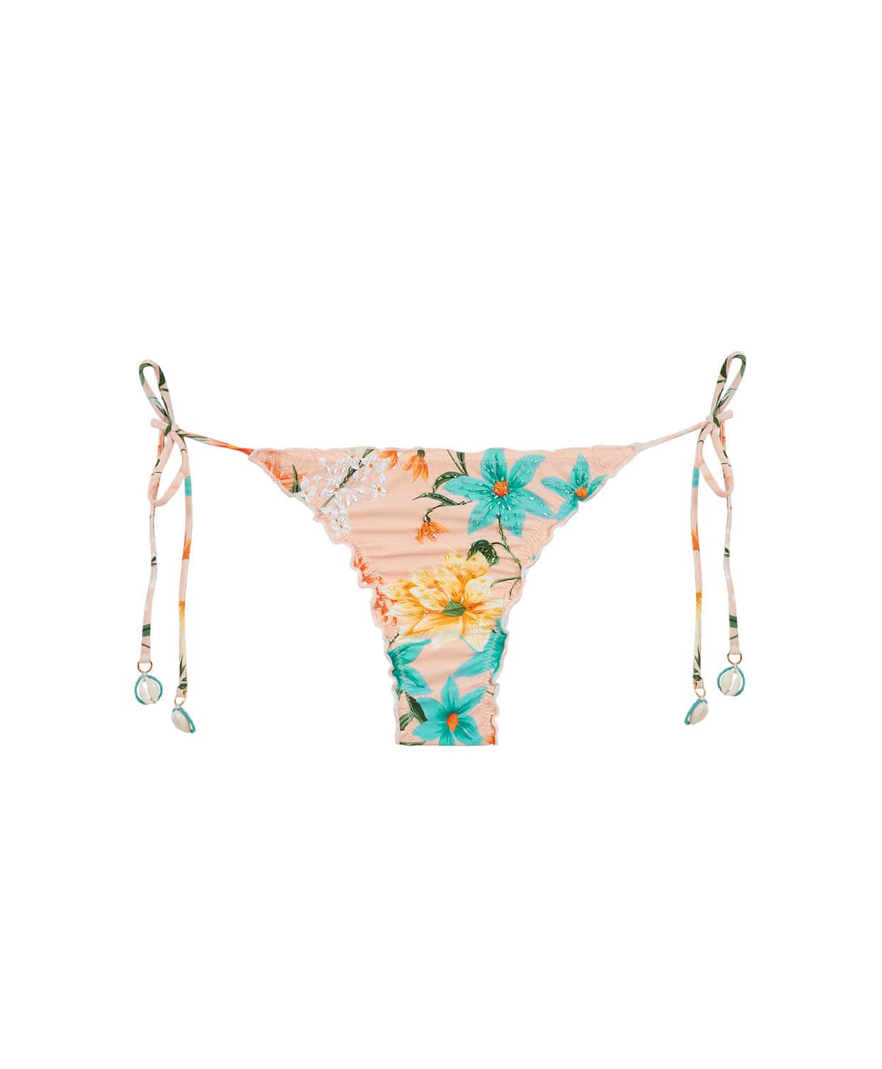 A bikini bottom with a tropical print and puca shells against a white wall.
