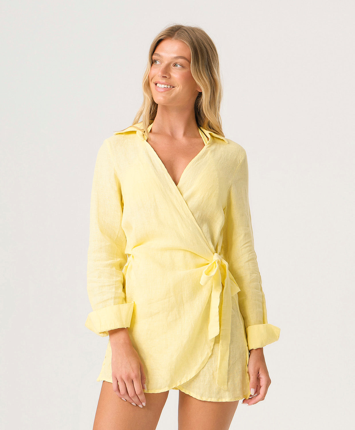 Buttercup Lily Cover Up in pastel yellow linen with classic collar, tailored sleeves, and adjustable side tie.
