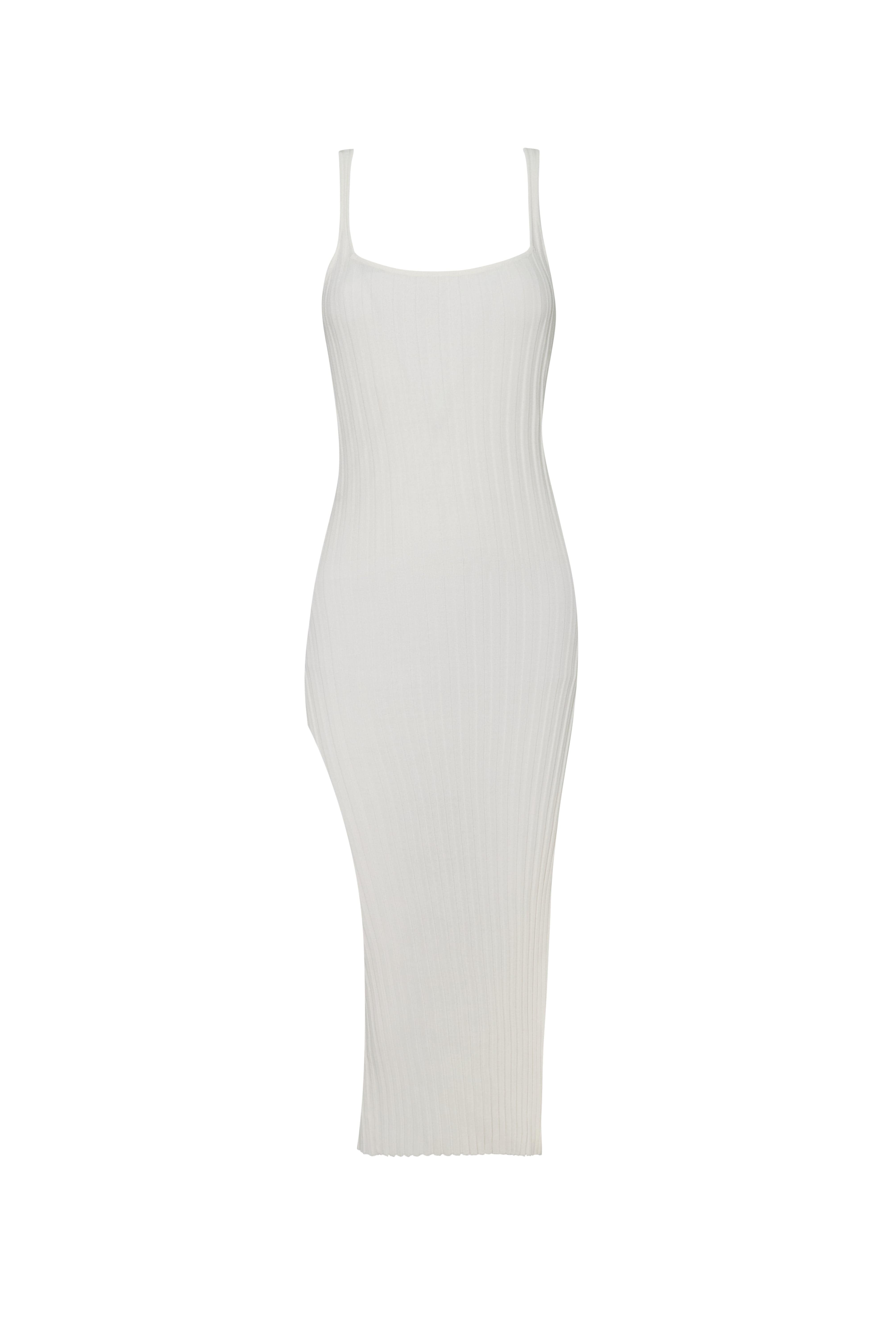 White slit dress in front of a white background.