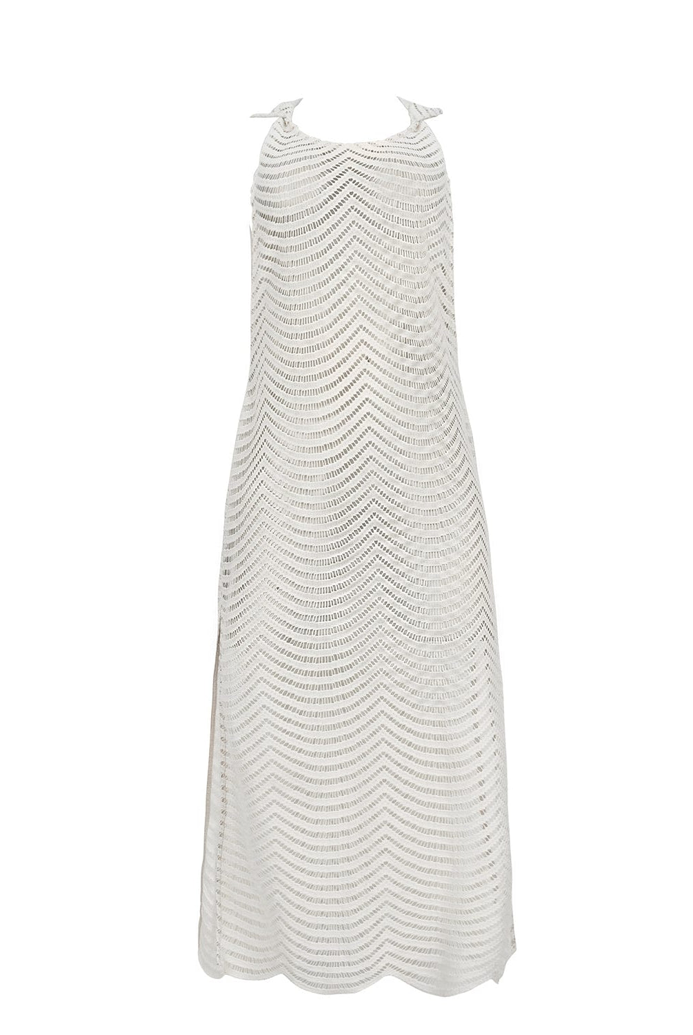 An ivory sleeveless cover up with scalloped lace detailing. Featured against a white wall background.