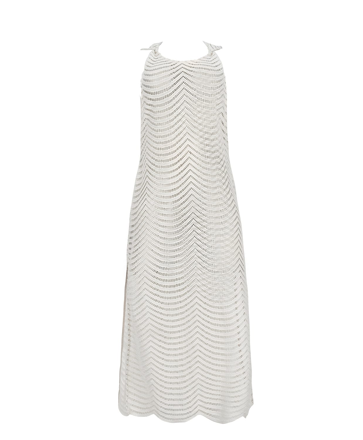 An ivory sleeveless cover up with scalloped lace detailing. Featured against a white wall background.