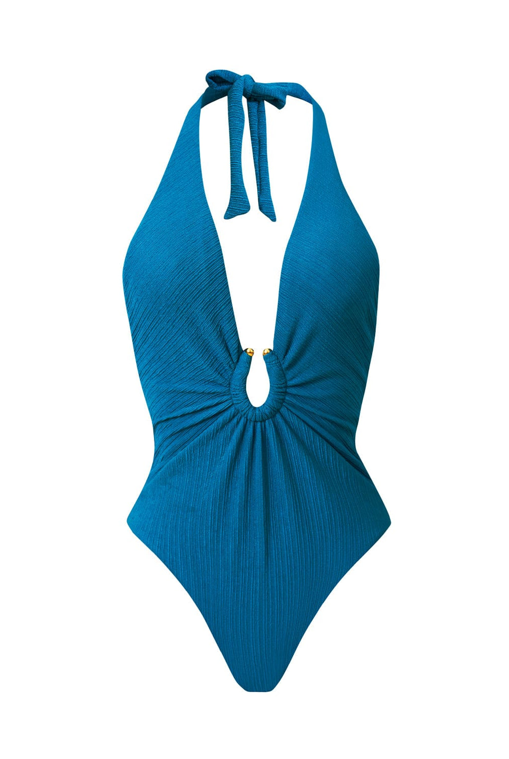 A textured turquoise halter one-piece swimsuit with gold details. Featured against a white wall background.