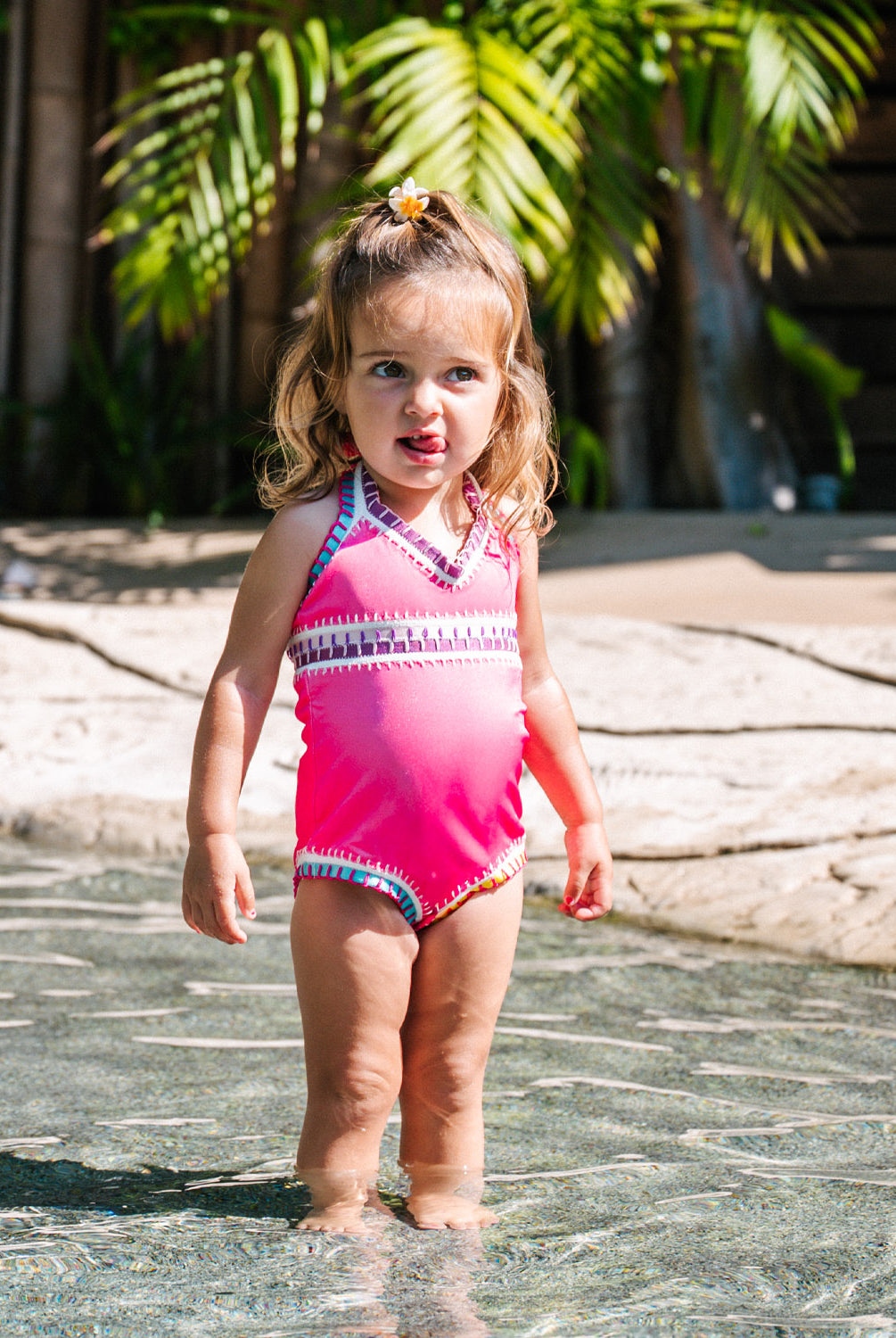 Kids Bright Pink Sadie Rainbow Embroidered One Piece swimsuit with multicolor elastic embroidery and soft tie-dye design.