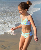 Kids Dolce Remy Seamless Bikini in soft blue floral print with scalloped trim and adjustable straps.