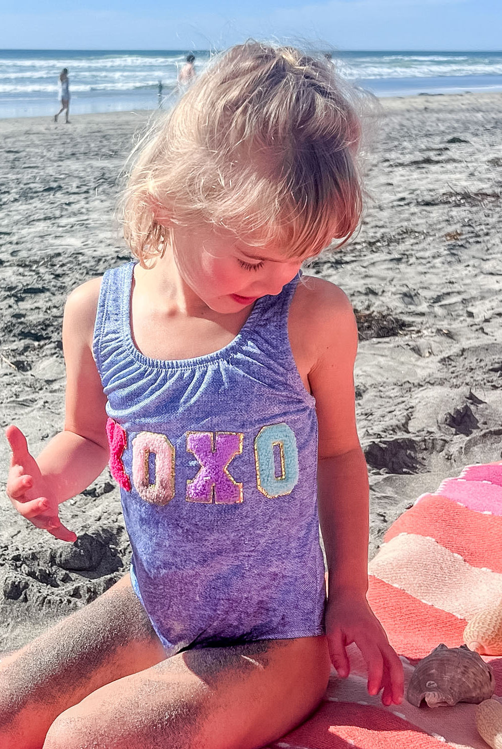 Kids Indie Sky XOXO One Piece swimsuit with subtle poolside sparkle, perfect for a cute getaway look.
