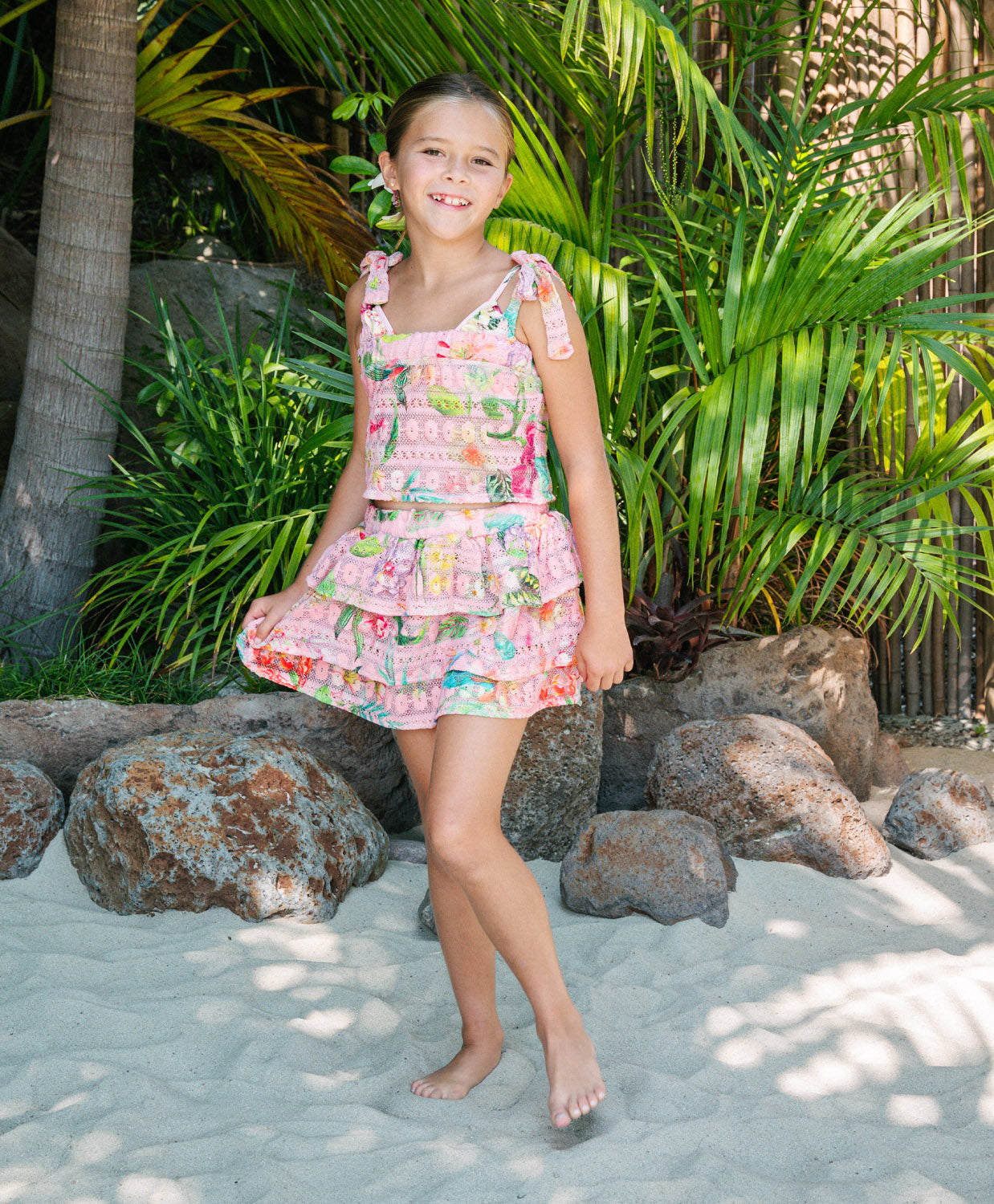 Kids Paradise Bloom Lucy Ruffle Skirt Set with tropical floral crochet fabric, playful ruffle skirt, and adjustable tie top for sunny adventures.