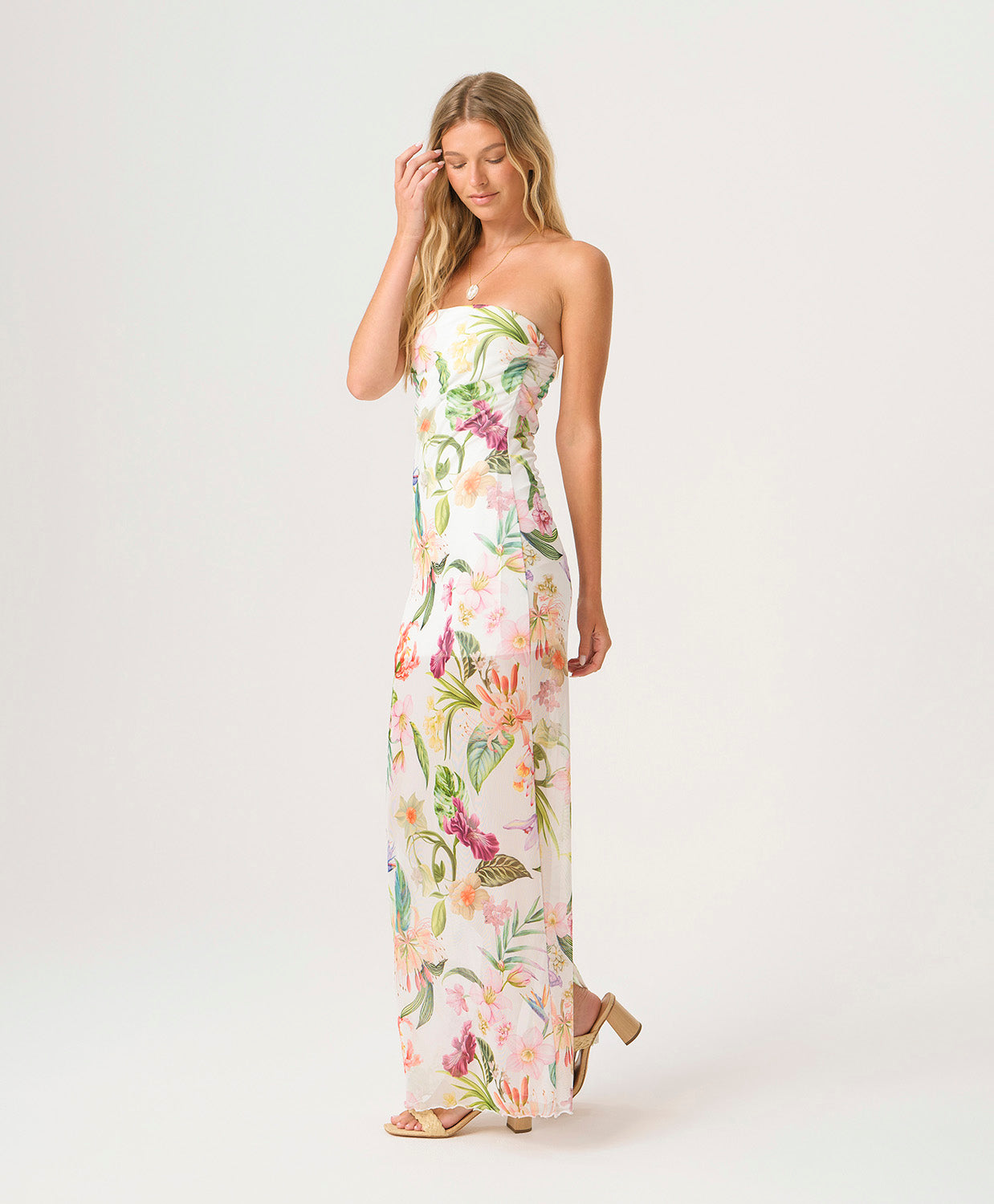 Paradise Bloom Sofia Tube Dress strapless floor-length dress with tropical floral print, sheer hem, and subtle back slit.