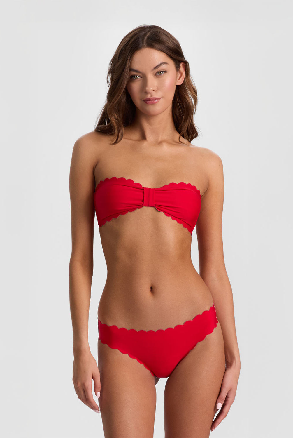 Teakwood Reversible Scalloped Bandeau strapless bikini top with scalloped trim, nautical stripes on one side and sea siren red on the reverse