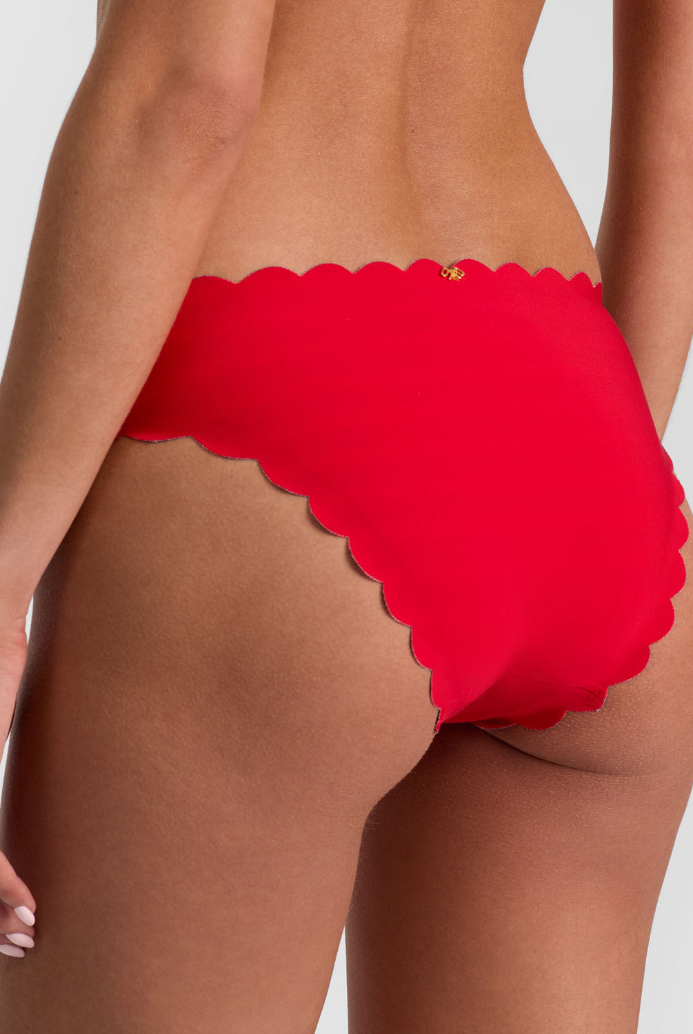 Teakwood Reversible Scalloped Bottom bikini with nautical stripes and red, scalloped trim.