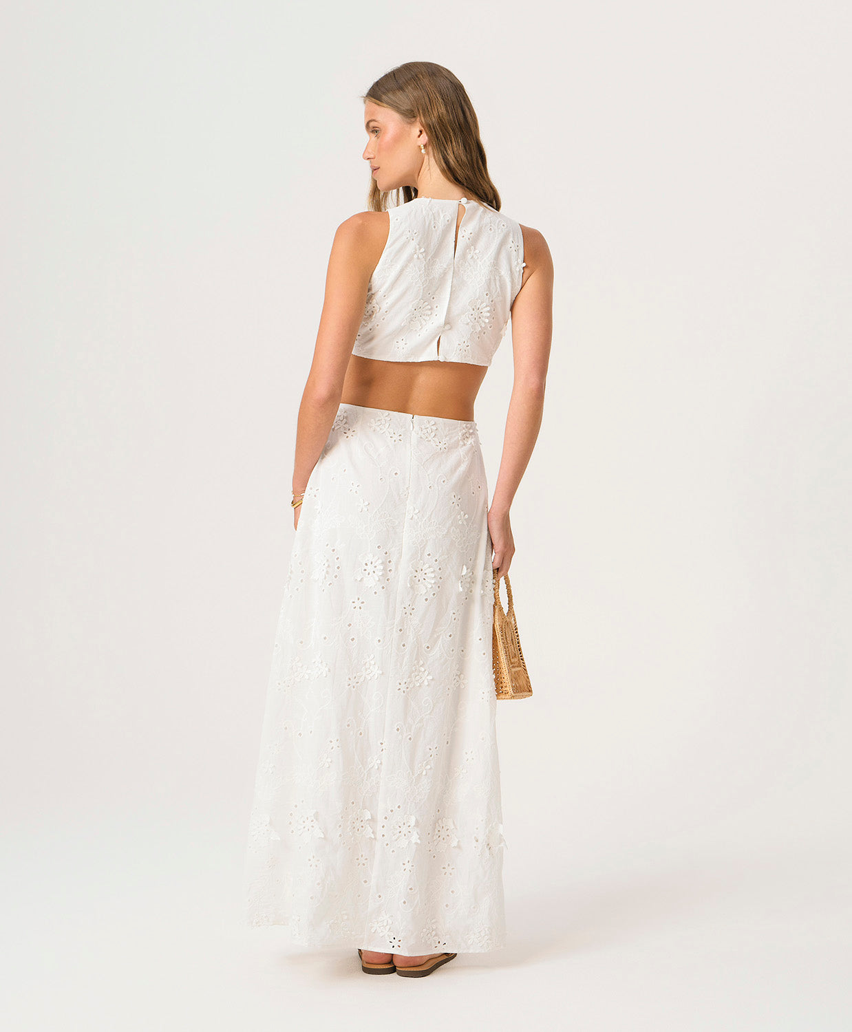 White Sands Tavi Dress in textured white eyelet fabric with center cutout and full-length feminine silhouette