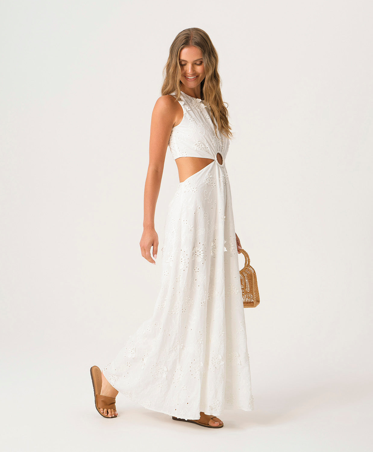 White Sands Tavi Dress in textured white eyelet fabric with center cutout and full-length feminine silhouette