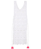 A white lace cover up dress against a white wall.
