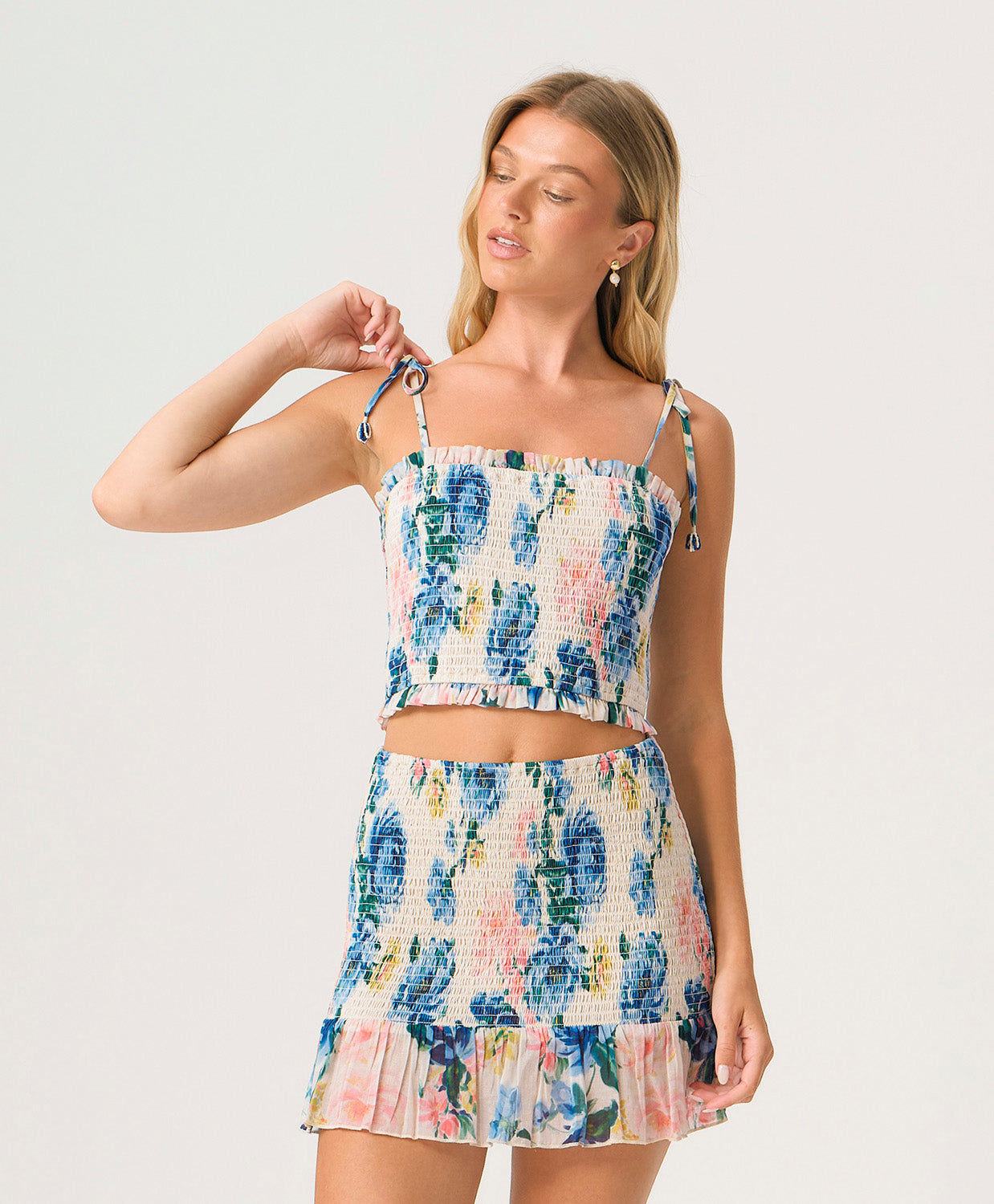 Blossom Ruby Smocked Skirt with floral print, fully smocked fit, and ruffled hem