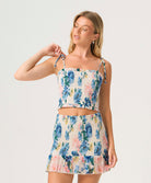 Blossom Ruby Smocked Skirt with floral print, fully smocked fit, and ruffled hem