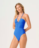 Woman wearing a blue swimsuit on a white background