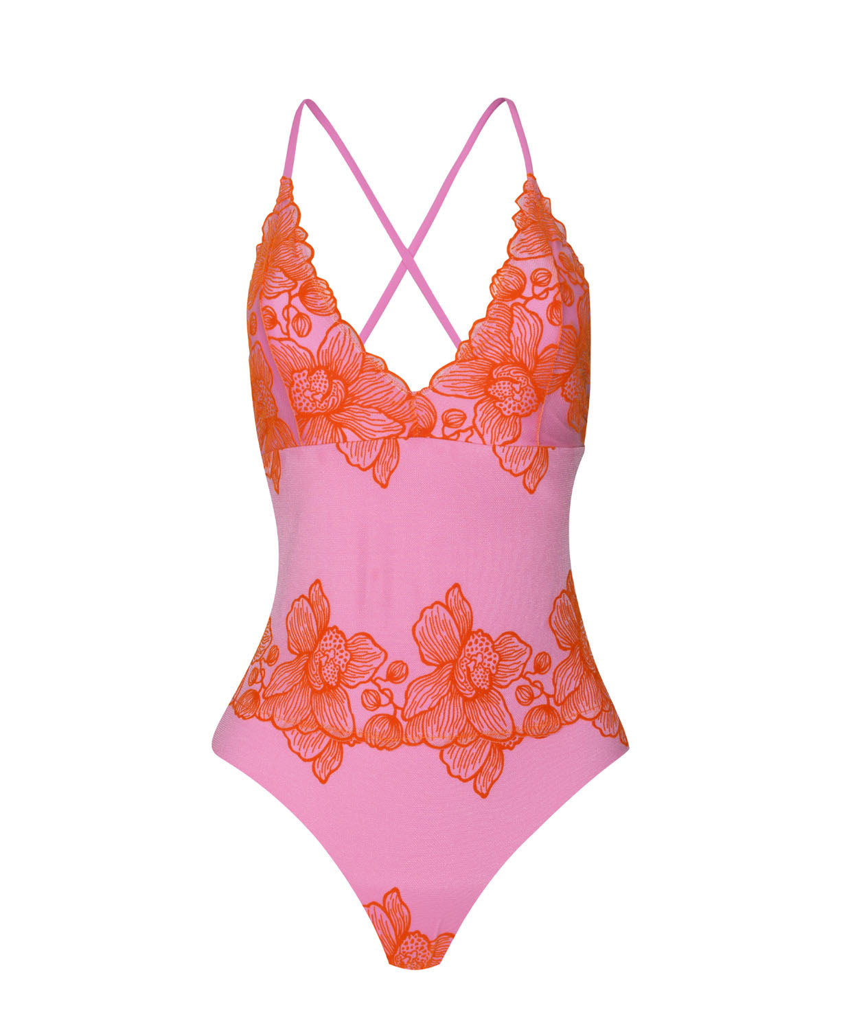 A pink one piece swimsuit with red floral accents against a white wall.