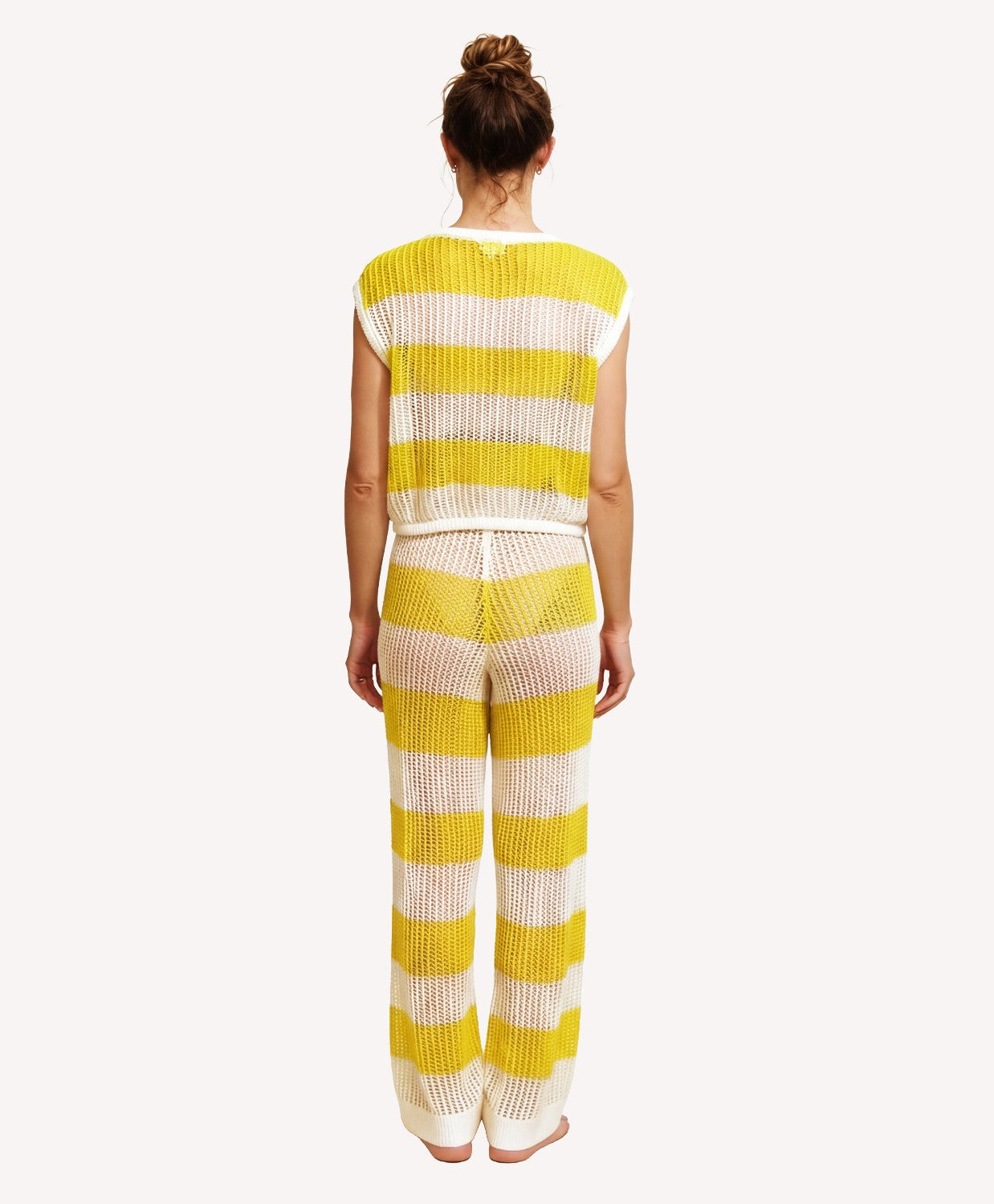 Person wearing a yellow and white striped outfit on a white background