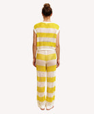 Person wearing a yellow and white striped outfit on a white background