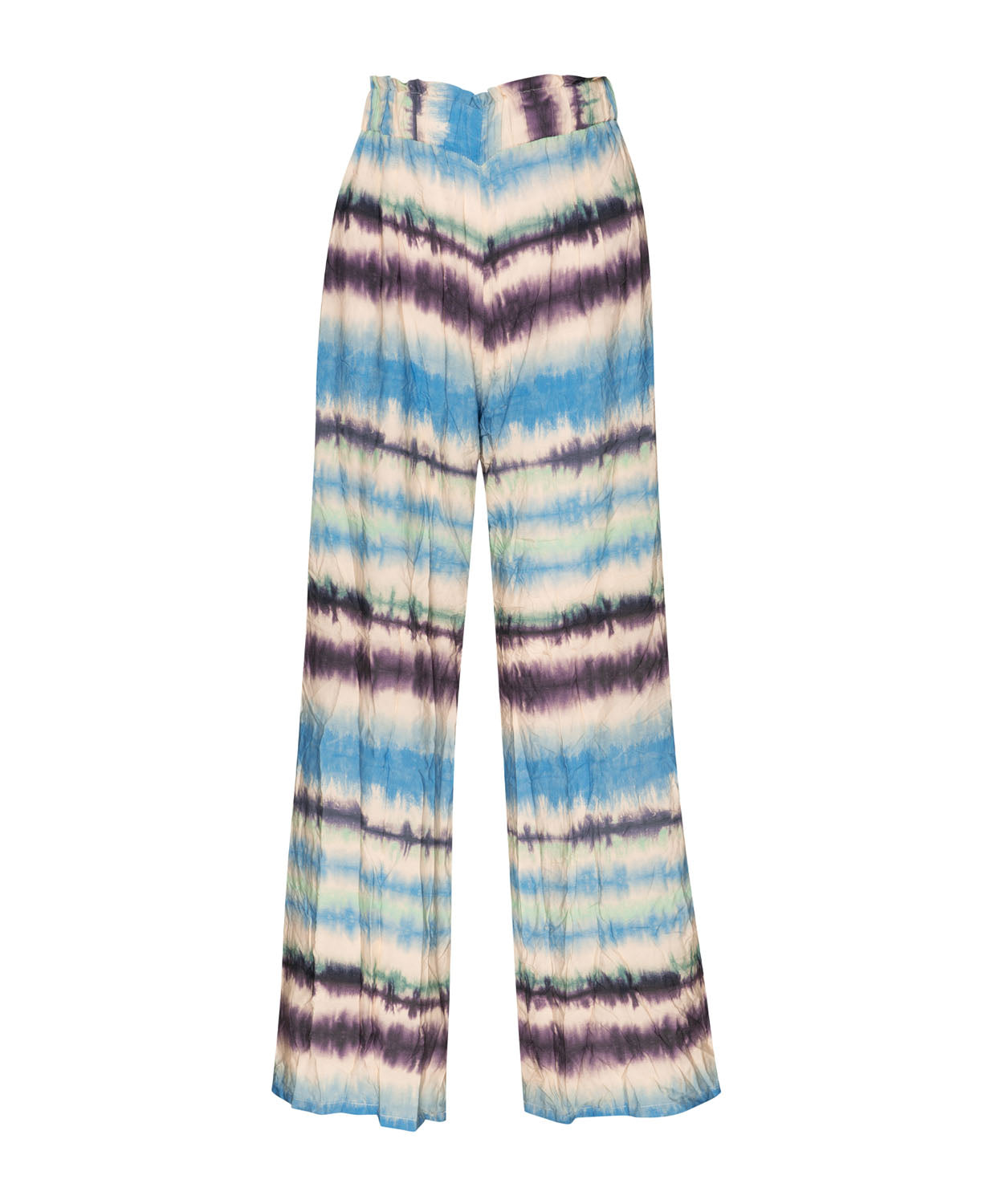Tie dye long pants against a white wall.