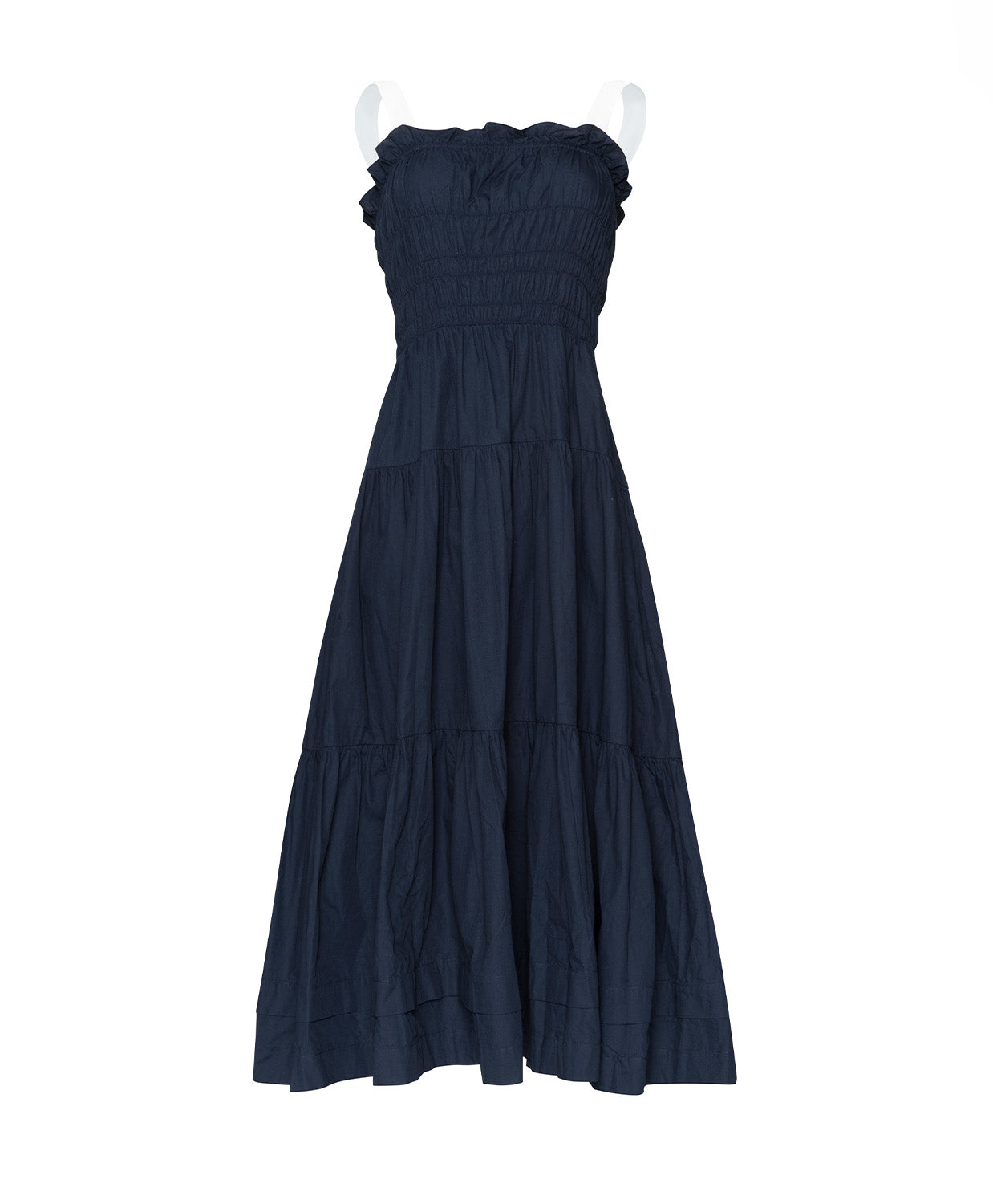 A navy dress with white straps against a white wall.