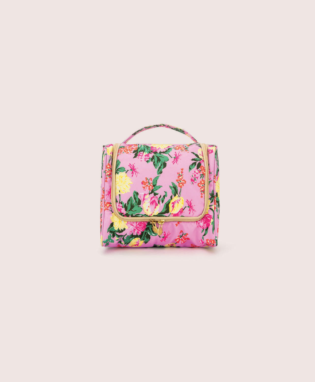 Floral-patterned toiletry bag on a light pink background