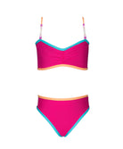 A pink bikini with blue trim against a white wall.