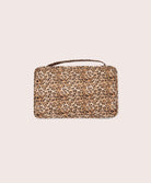 Leopard print packing cube on a beige background