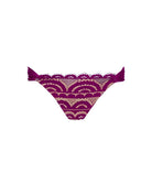 A pair of women's bikini bottoms in a deep magenta-purple color, featuring a semi-sheer mesh panel decorated with a beige and white scalloped wave pattern, finished with a scalloped lace trim.
