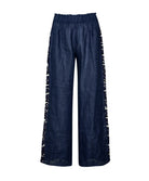 Navy Jace Lace Pant in airy navy linen with hand-cut lace side panels and a ruched waistband for a feminine, resort-ready look.