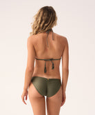 Woman wearing a green bikini on a white background