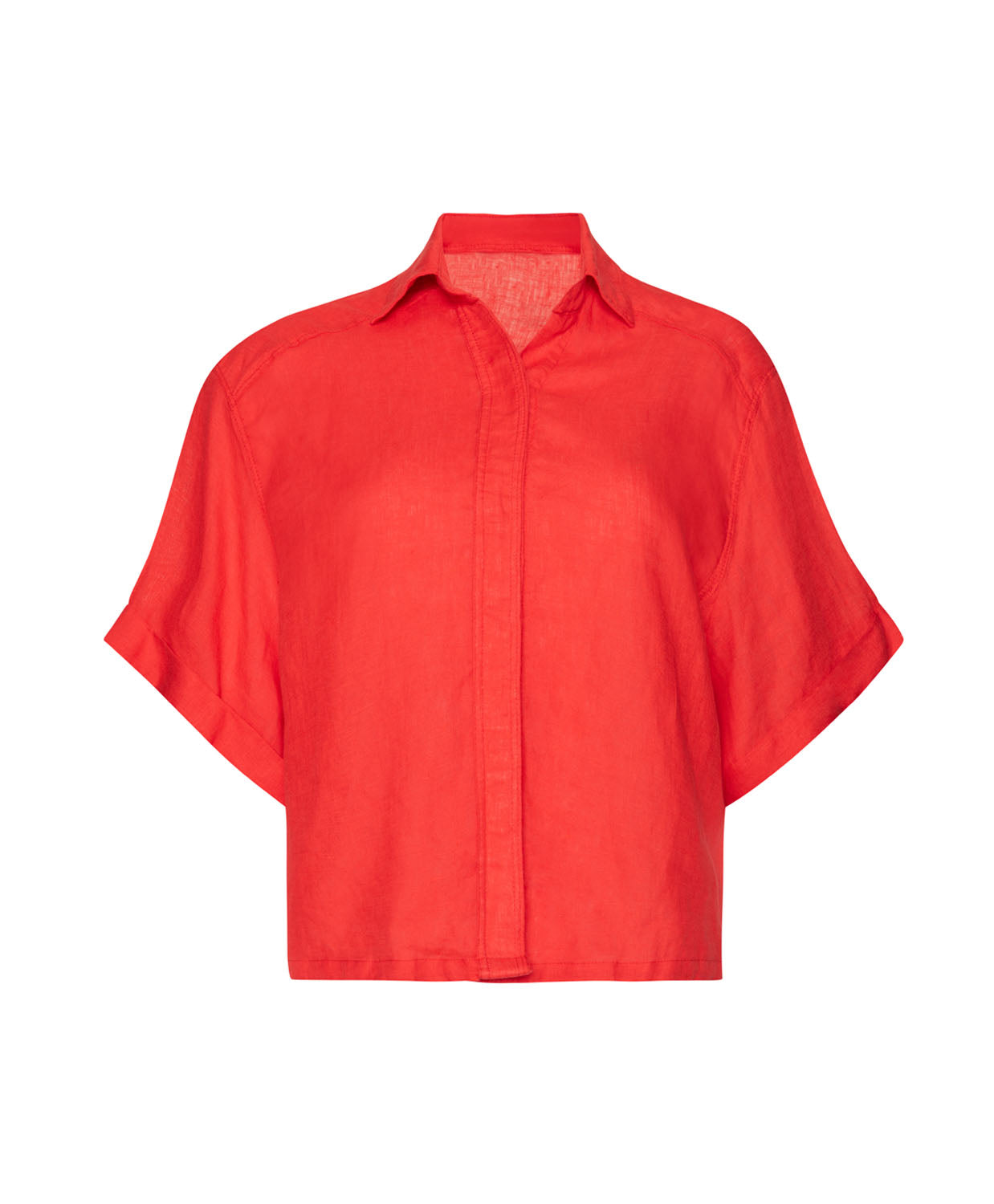 A red short sleeve linen top against a white wall. 