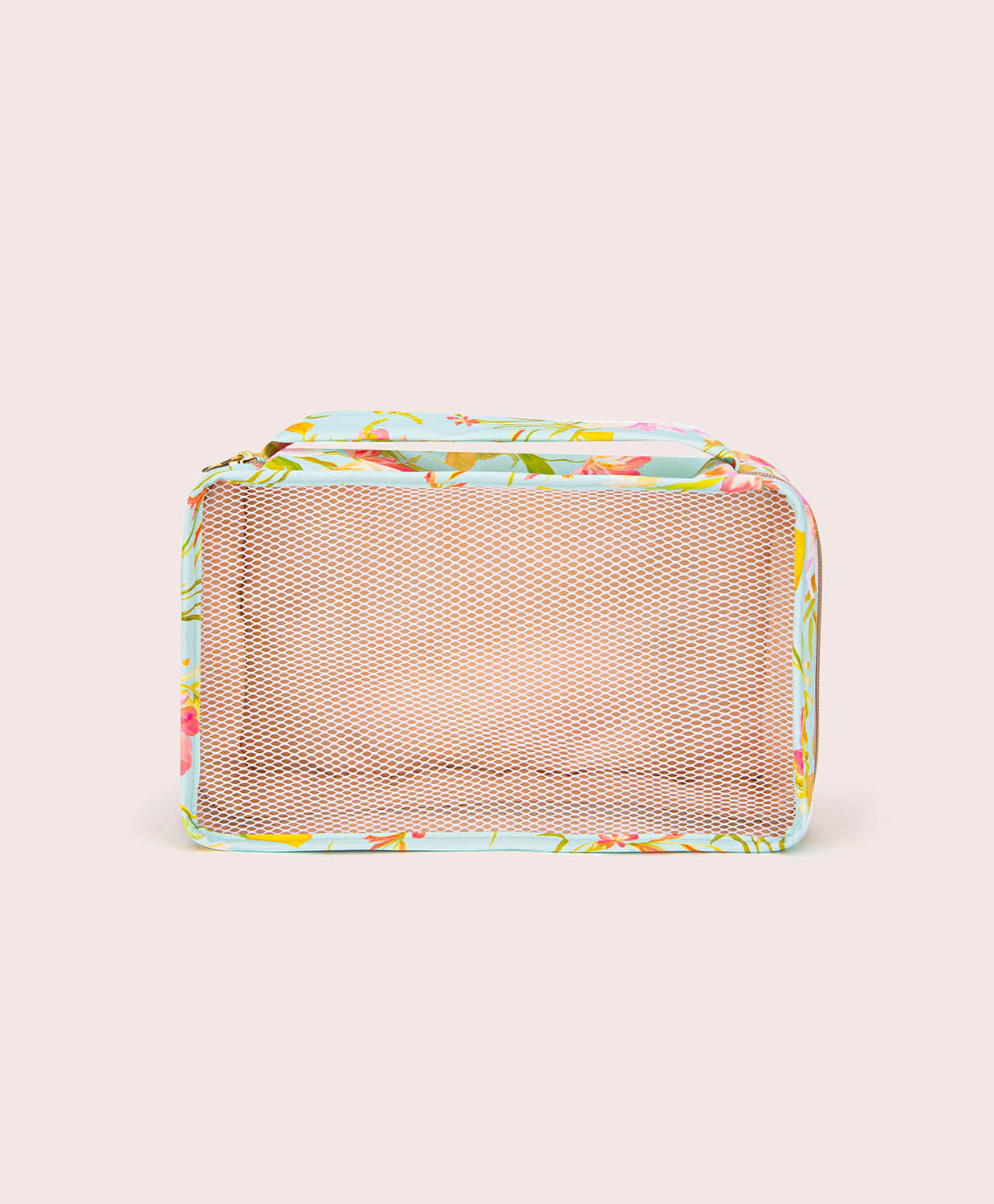 Rectangular mesh packing cube with floral pattern on a beige background