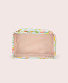 Rectangular mesh packing cube with floral pattern on a beige background