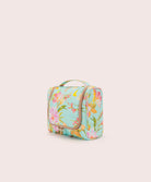 Floral-patterned toiletry bag on a light beige background