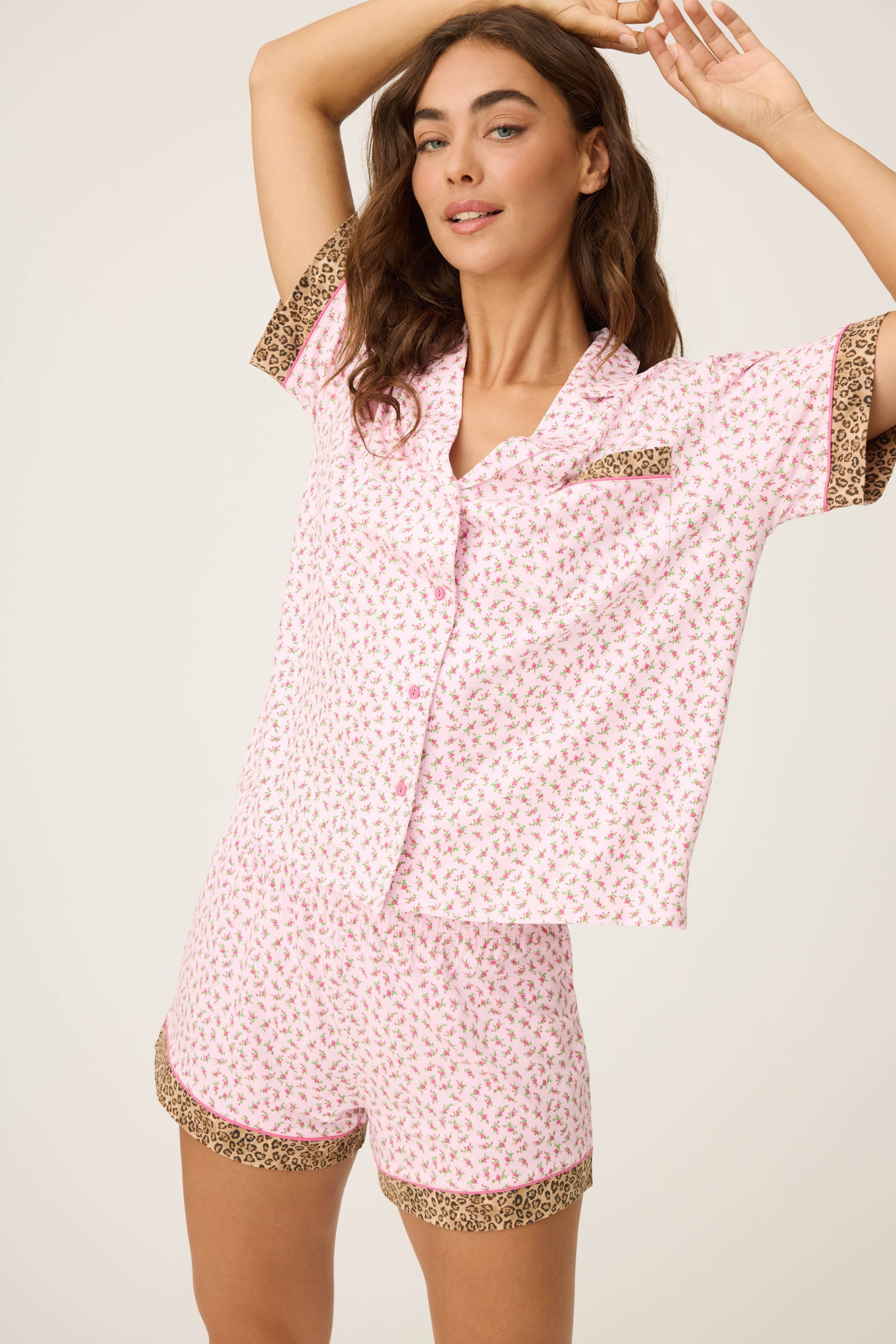 Ditsy Floral Shorts Set featuring pink ditsy florals with leopard-print trim, button-down top, and matching pull-on shorts.