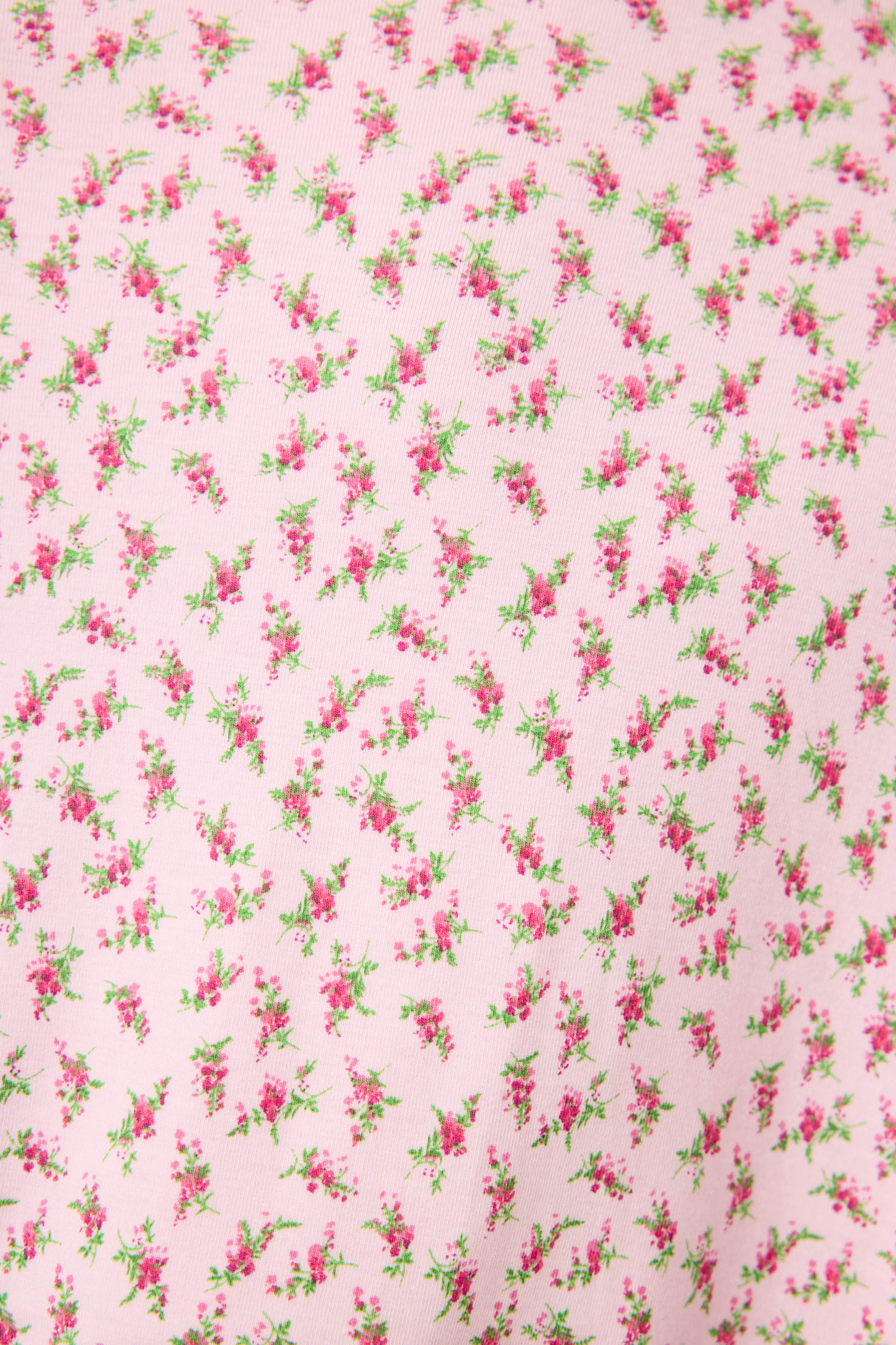 Ditsy Floral Robe featuring a pink ditsy floral print with leopard trim, wide sleeves, and a relaxed, silky-soft jersey fit.