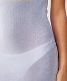 Close-up of a light gray sleeveless top with a geometric pattern.