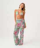 Woman wearing a floral two-piece set on a white background