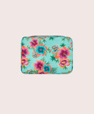 Floral patterned packing cube on a beige background