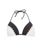 A black and white triangle bikini top with stud details. Featured against a white wall background.