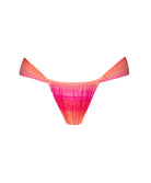 A multi colored bikini bottom against a white wall.