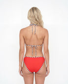 Red bikini with a patterned strap on a white background