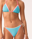 Blue and pink bikini with a white background